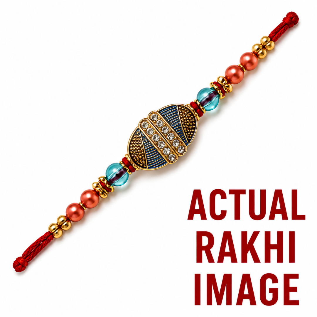 A traditional Indian Rakhi bracelet shown diagonally on a white background, featuring a central gold-toned medallion with blue and red detailing, flanked by coral beads, clear rhinestones, and blue glass beads. Bold red text on the right reads 'ACTUAL RAKHI IMAGE'.